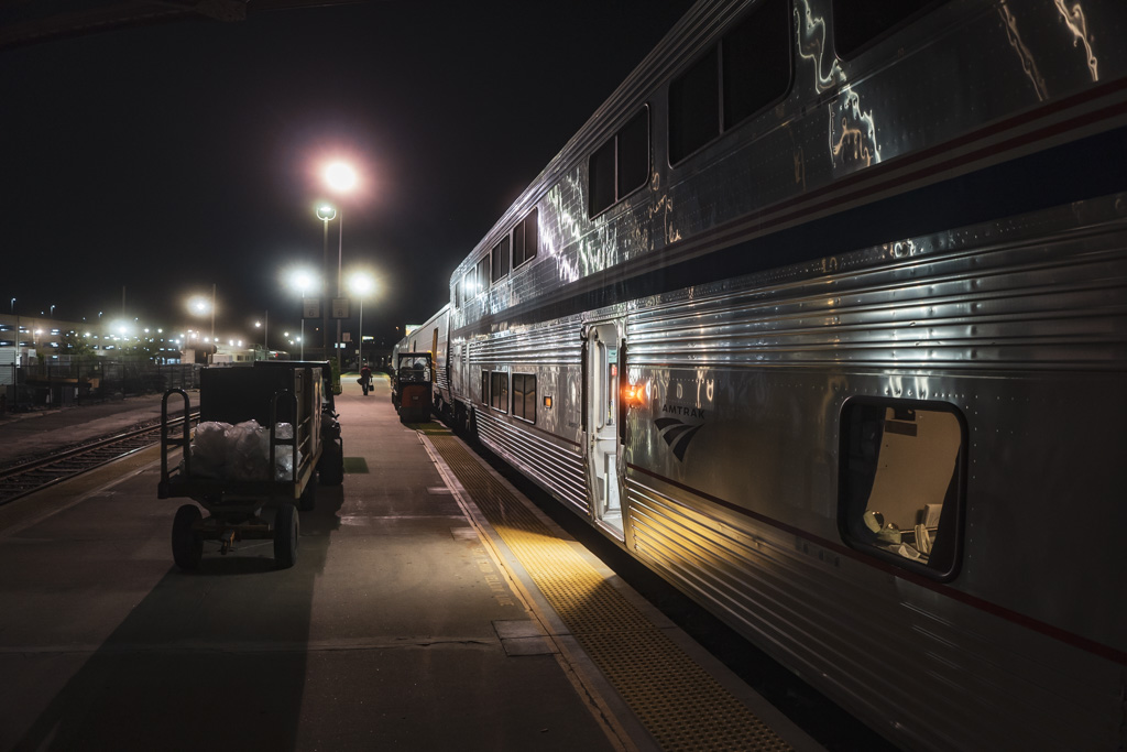 An Amtrak Superliner stop at night