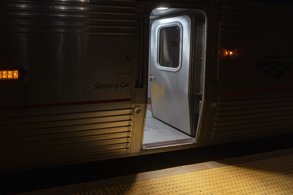 An Amtrak Superliner stop at night